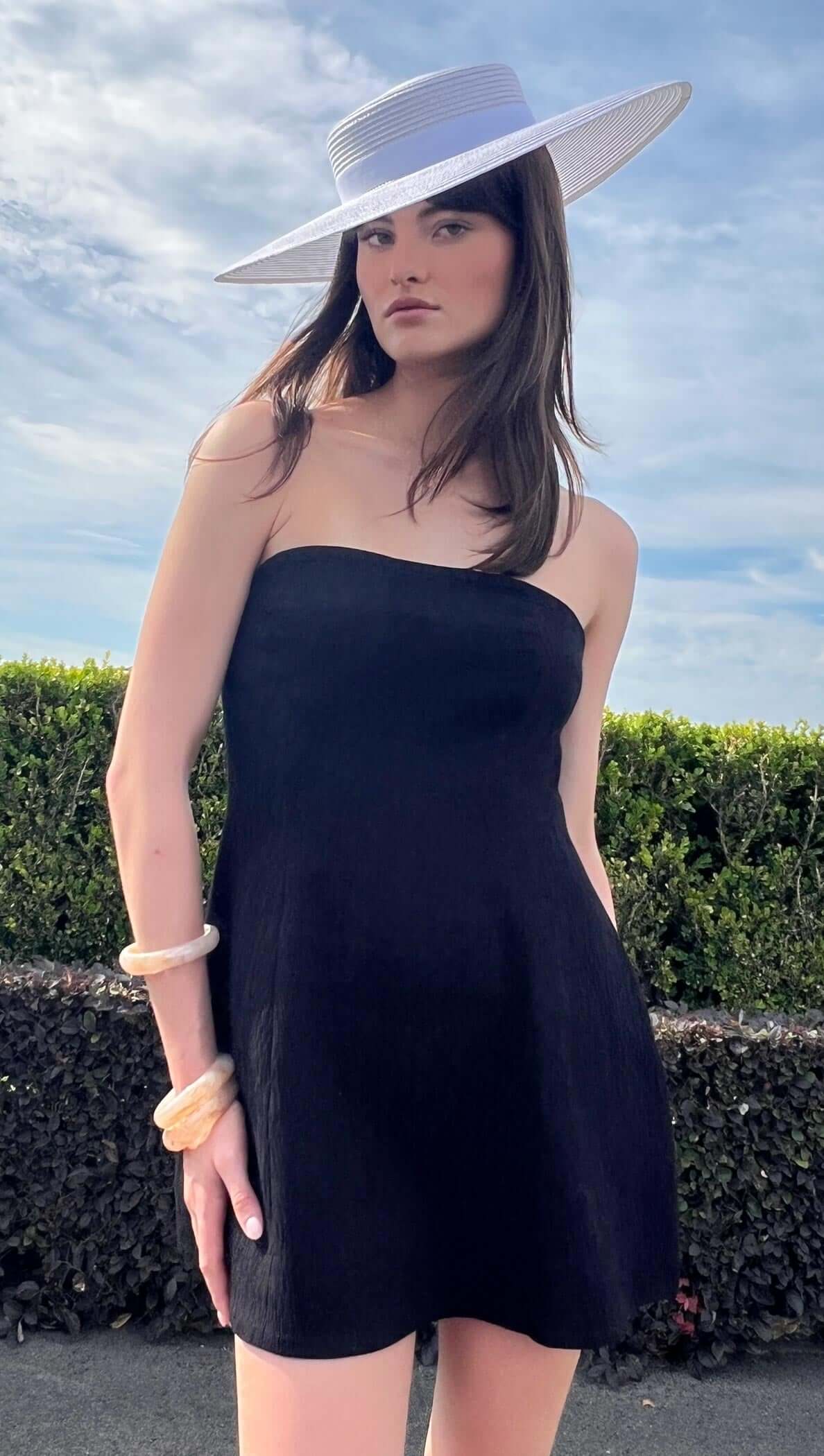 BLACK STRAPLESS PEPLUM MINI DRESS